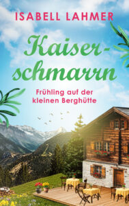 Man sieht das Cover von „Kaiserschmarrn - Frühling auf der kleinen Berghütte“. Das Cover zeigt eine rustikale Berghütte auf einer Wiese mit einer Terrasse, auf der Tische mit gelben Tischdecken stehen. Im Hintergrund erheben sich hohe Berge, der Himmel hat leichte Wolken. Die Stimmung ist angenehm-harmonisch.